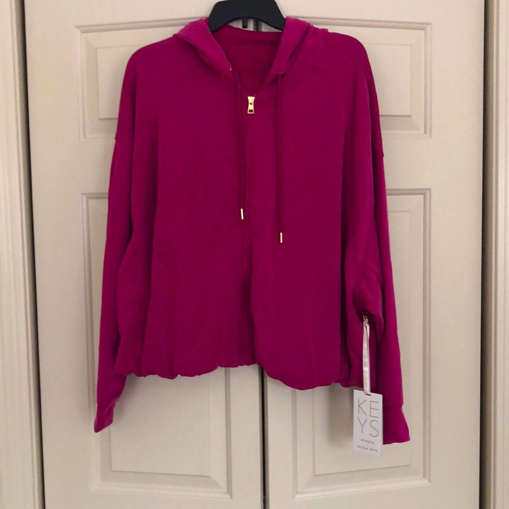 Exquisite deep pink Athleta zip up hoodie top with Dolman sleeves and pockets.